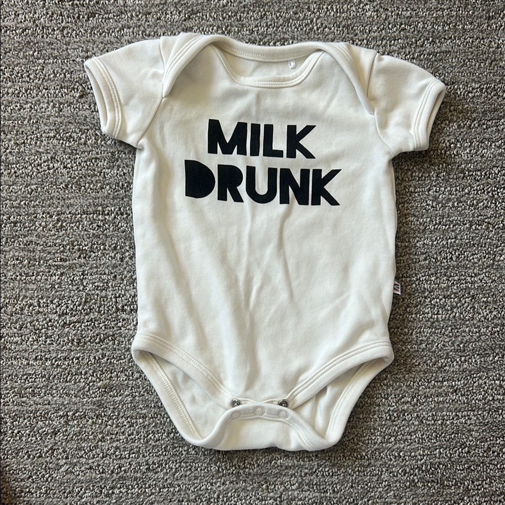 Cream Baby Onesie with Black Text